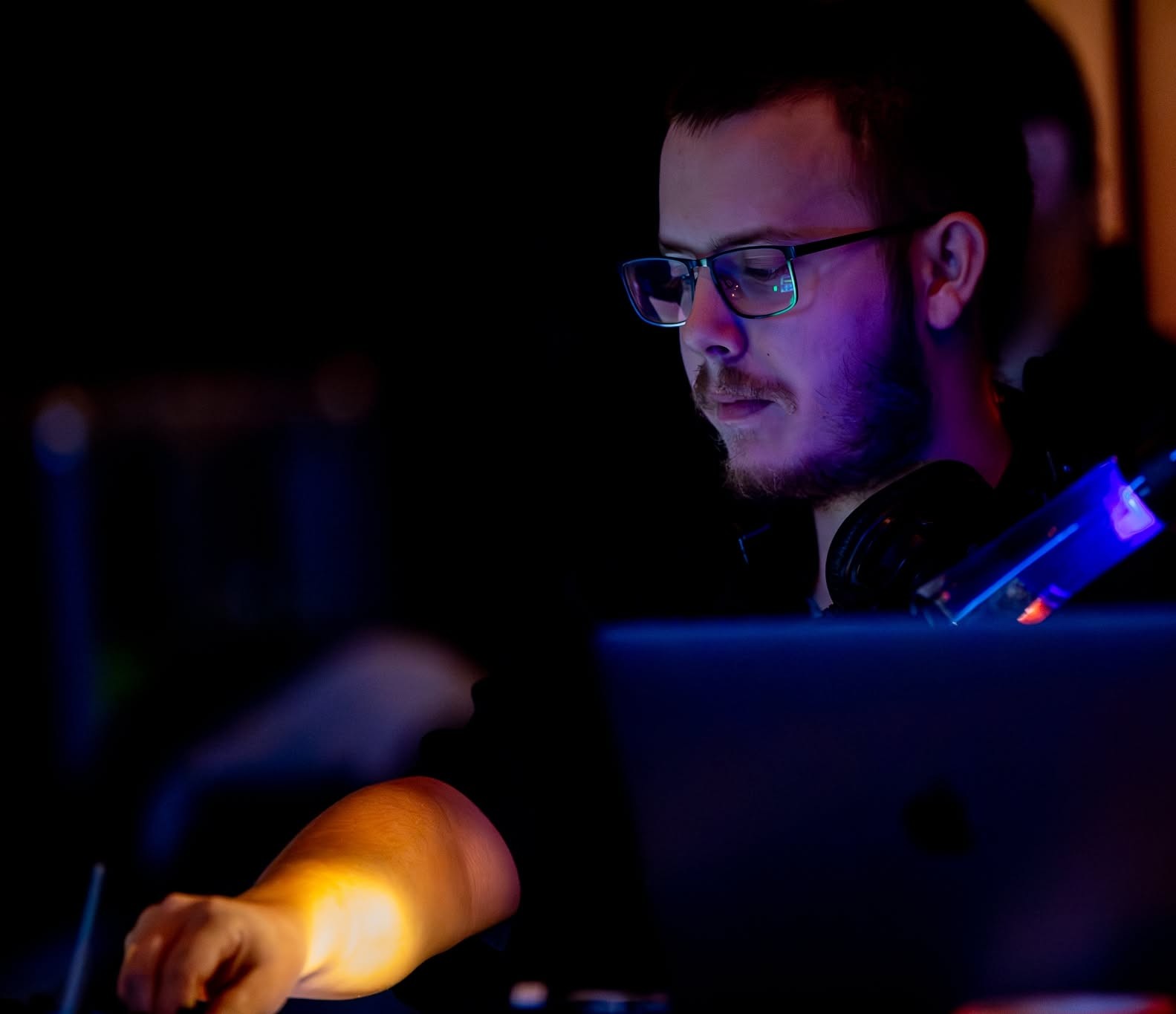 Jonas Rasmussen working with live audio equipment during a production